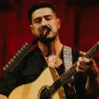 Marcus Mumford performing with Mumford & Sons at Folsom Field in Boulder June 6. Photo by Alden Bonecutter